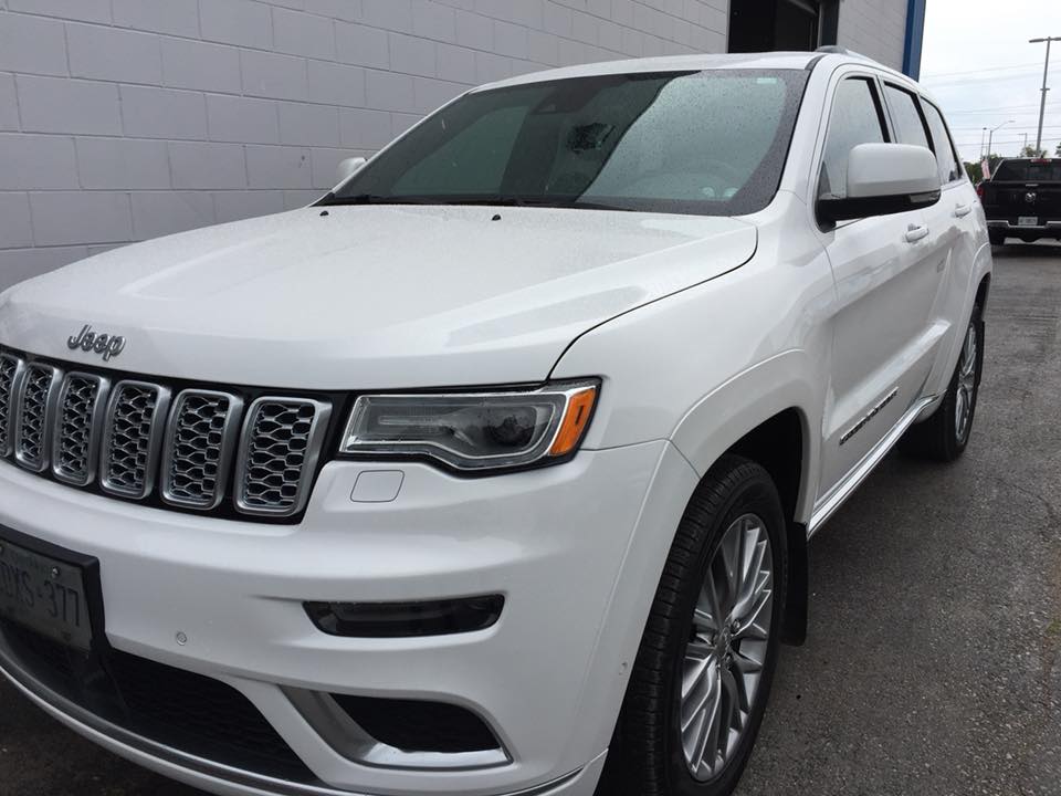White Jeep Grand Cherokee exterior after detailing