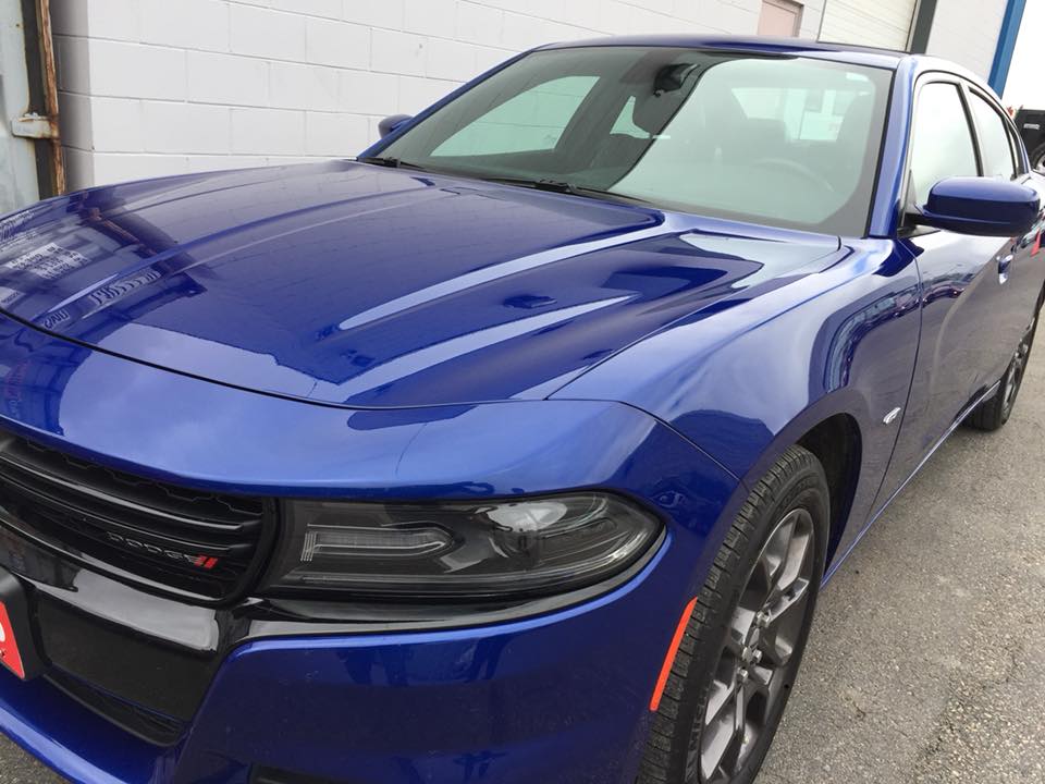 Polished blue Dodge Charger after detailing
